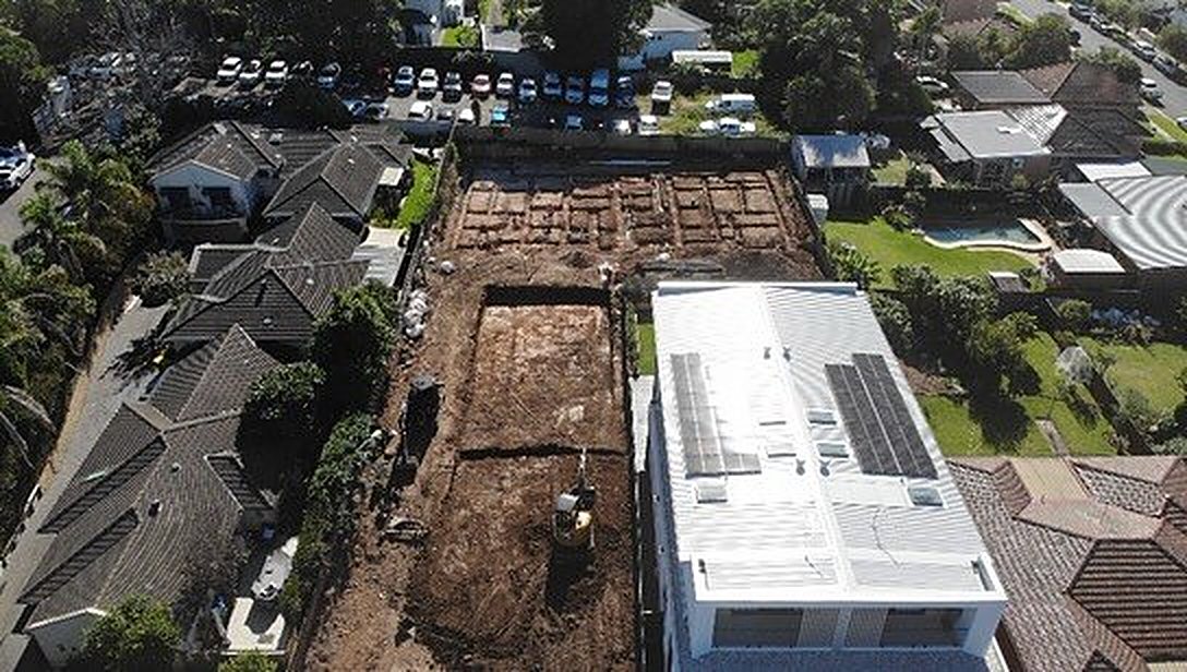 Bulk excavation beside a new two storey home